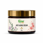 A 50g jar of Gyan Yeda Anti Aging Cream, featuring a shiny gold metallic lid and a cream-colored label decorated with botanical illustrations, set against a plain white background.